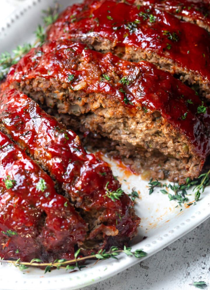 A picture of a southern meatloaf with ritz cracker on a plate 