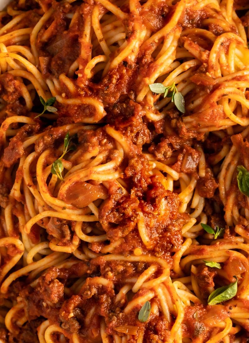 A close up photo of meat sauce on a plate
