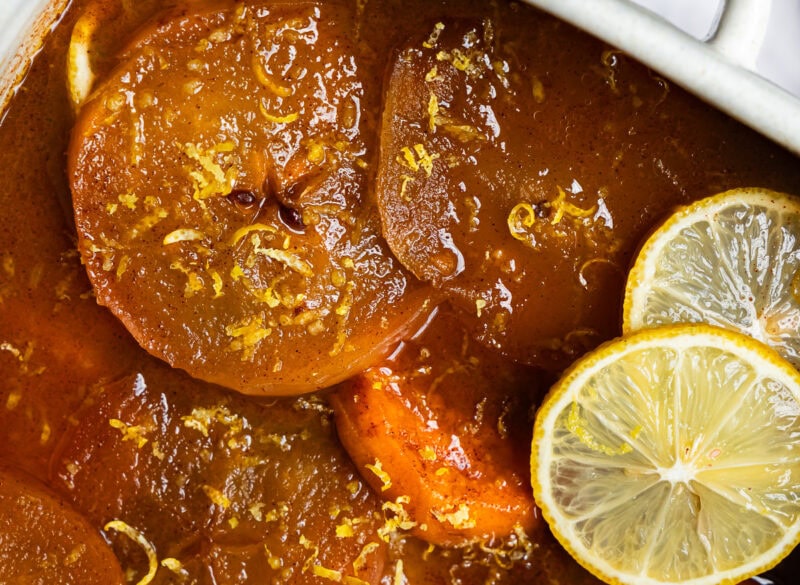Vintage sweet potato apple casserole with golden caramel edges and a sprinkle of lemon zest.