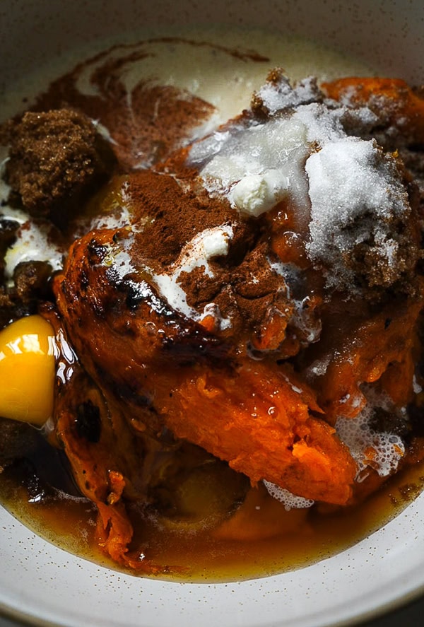 sweet potato casserole filling ingredients in a bowl. 