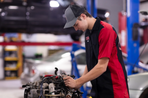 Auto mechanic diagnosing car engine at Whistler’s Auto Repair & Tires.