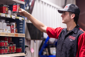Technician selecting automotive oil filters at Whistler’s Auto Repair & Tires.