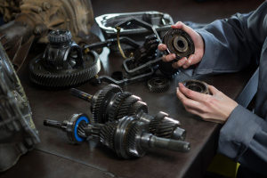 Professional mechanic conducting transmission repairs