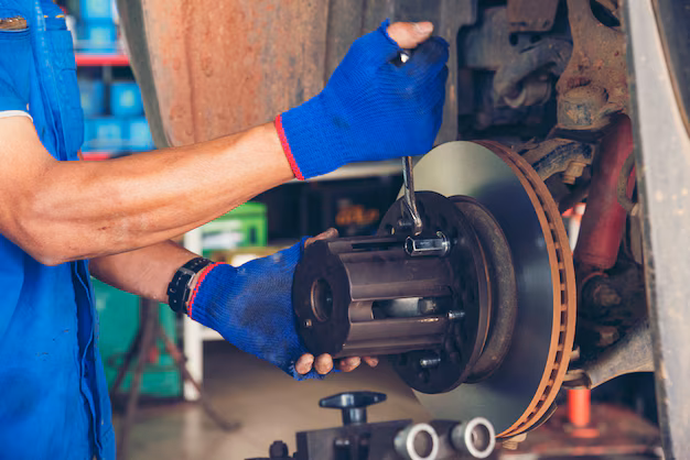 Mechanic working on brake plate