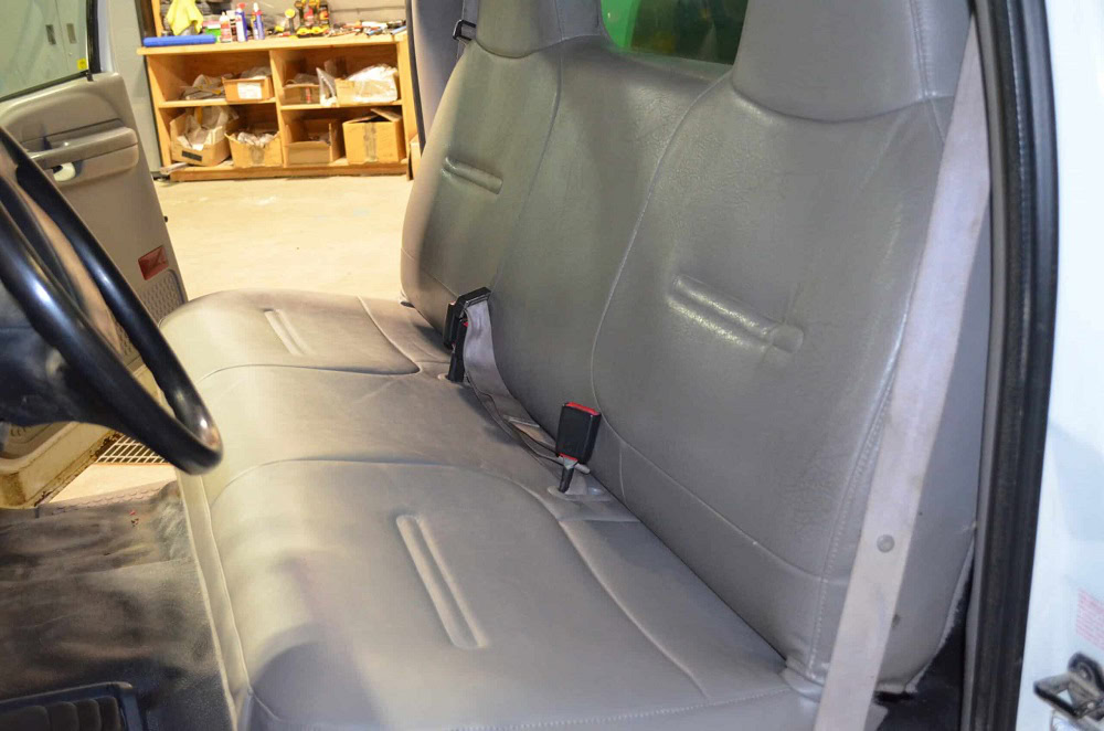 Clean and refreshed vehicle interior with new upholstery and detailing.