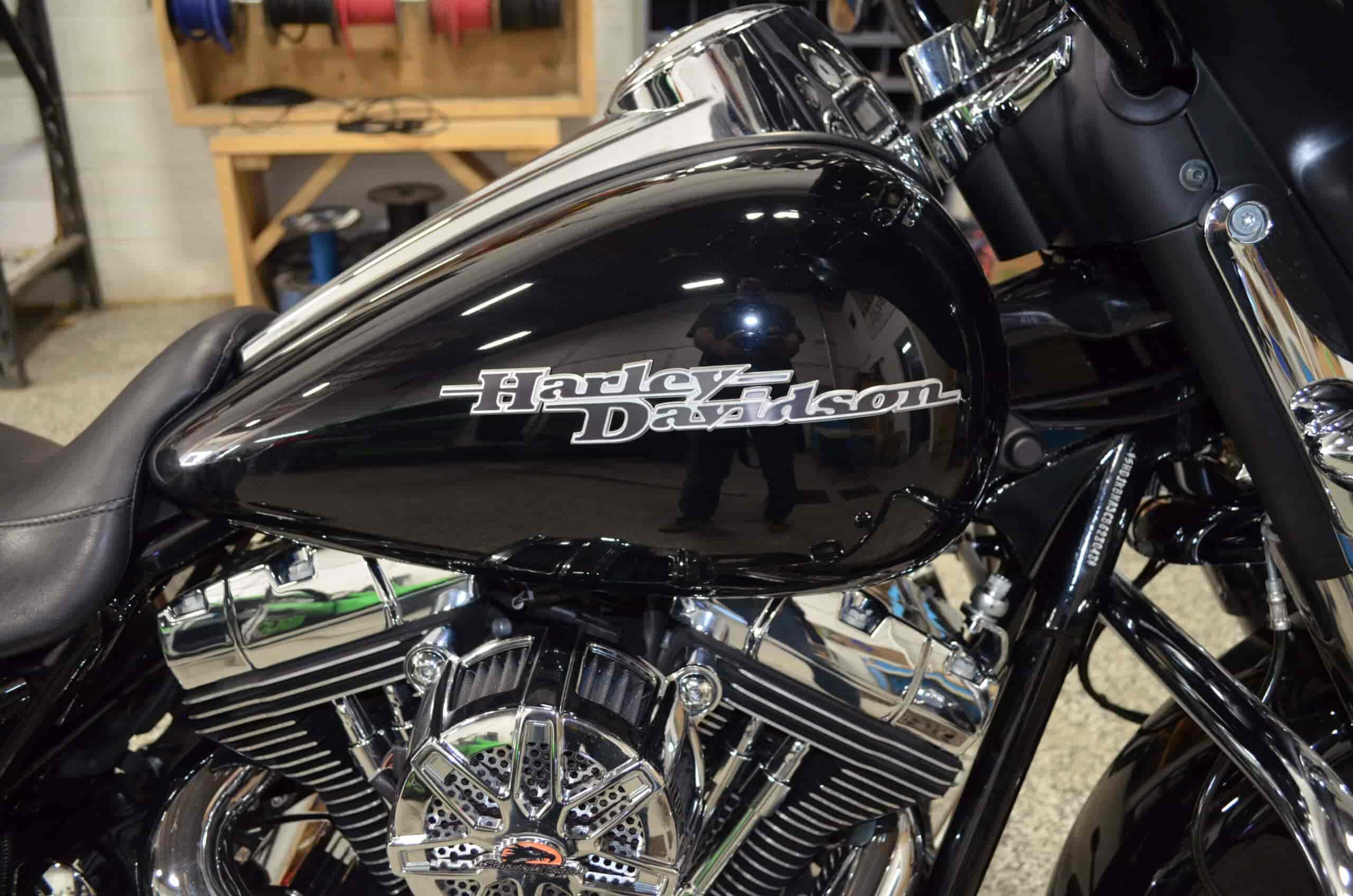 Custom black Harley Davidson motorcycle with chrome engine details.