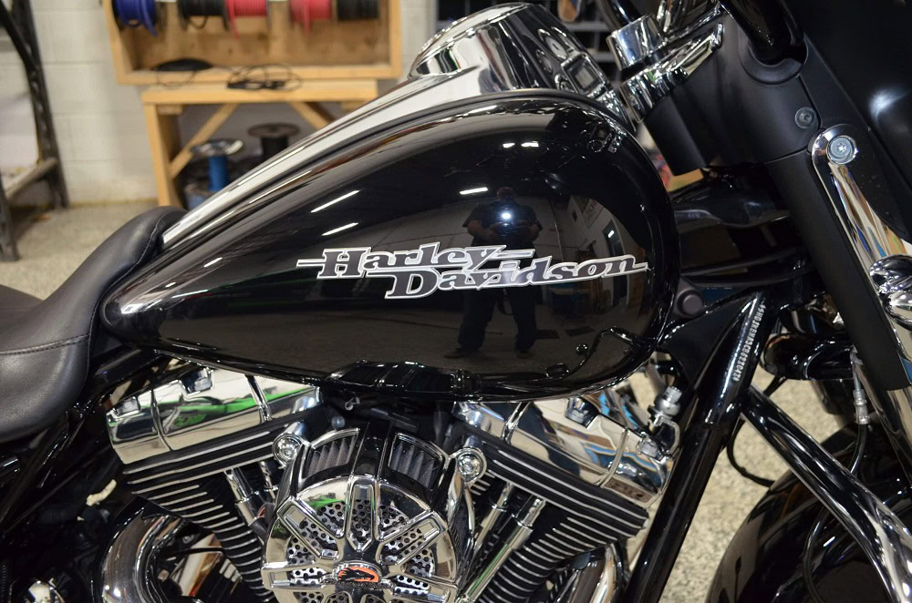 Custom Harley Davidson motorcycle with black finish and chrome details.