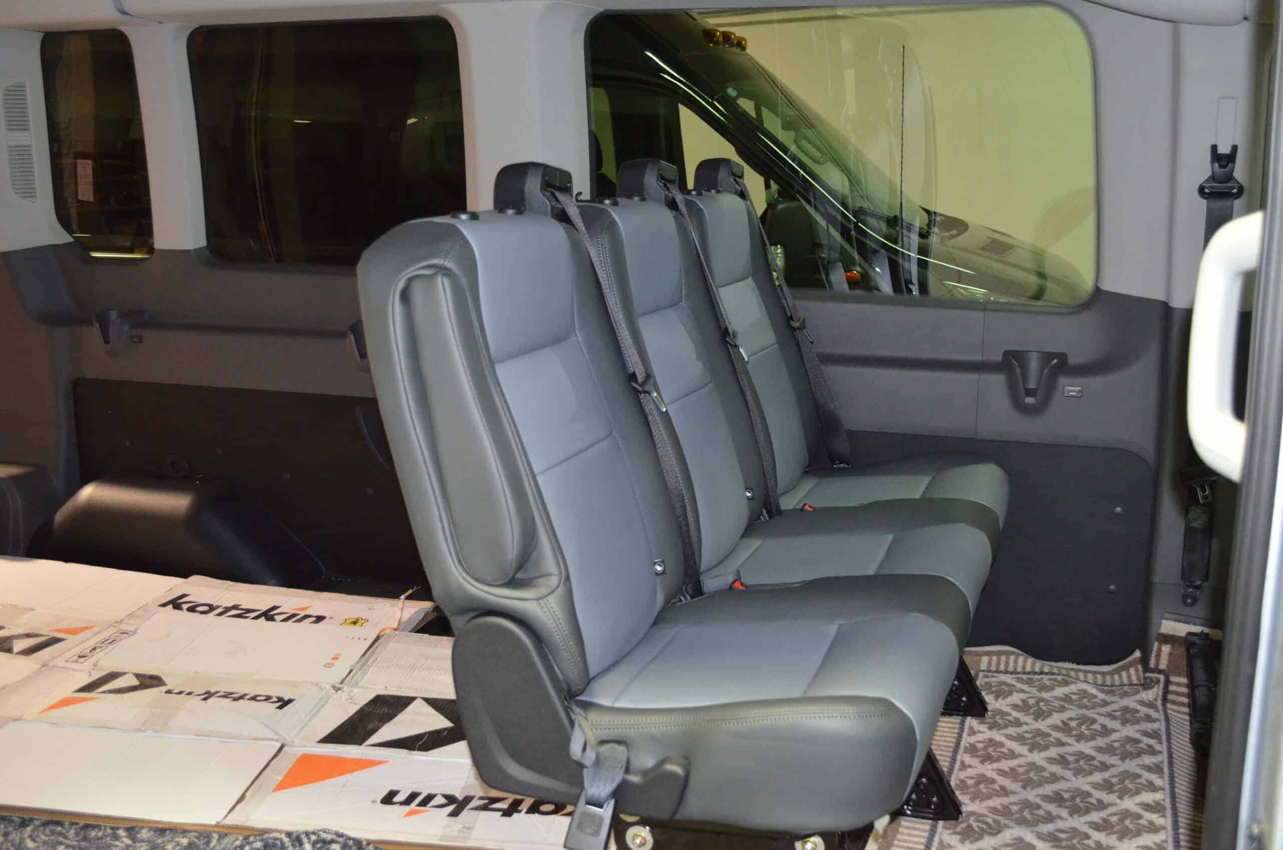 ReStyled van interior featuring upgraded gray leather seats for comfort and style. Perfect for comme.