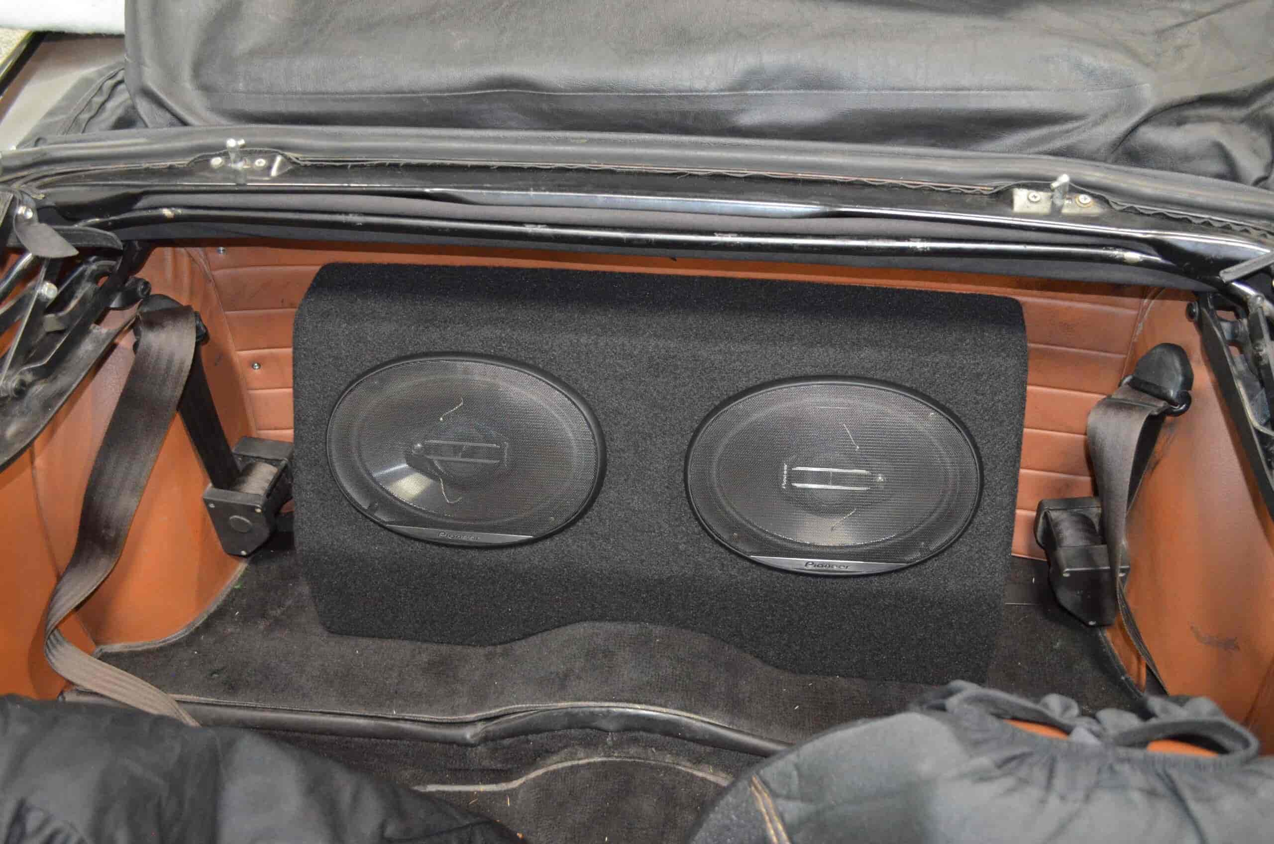 Custom car subwoofers installation by Wright ReStyling for enhanced audio.