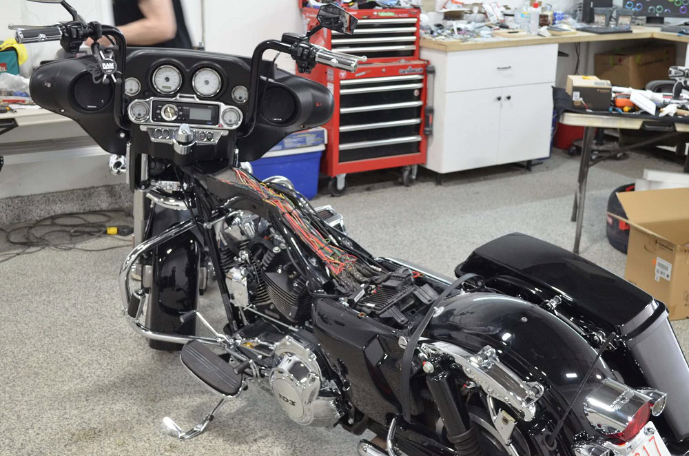 Motorcycle dashboard and wiring repair at Wright ReStyling workshop.