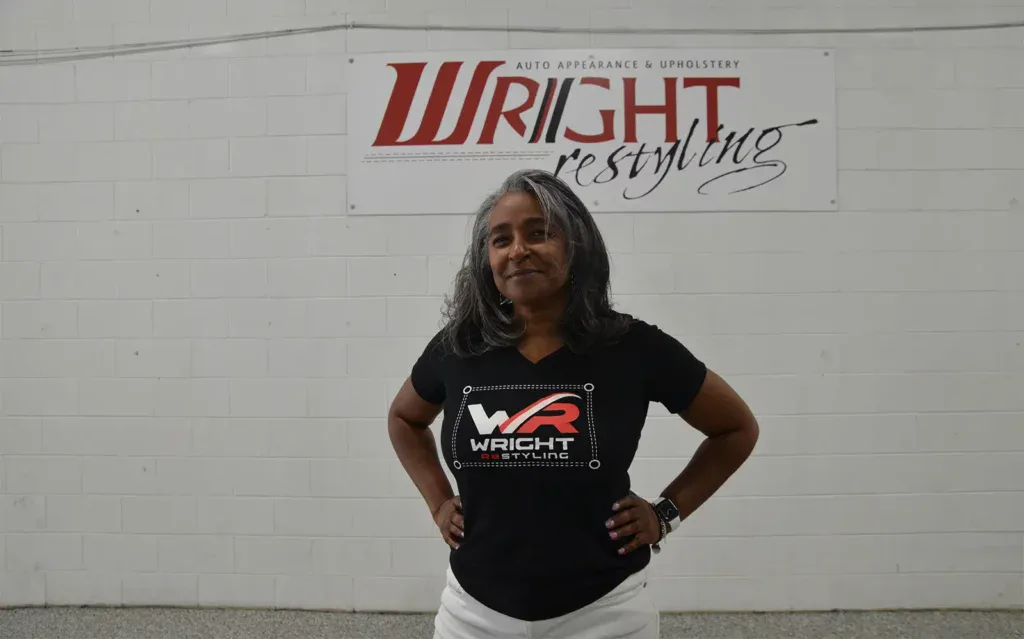 Wright ReStyling auto appearance center with a confident woman in front.