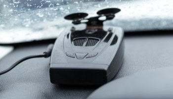 Car dash camera mounted on vehicle dashboard for safety and recording.