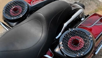 Close-up of motorcycle seat with custom audio speakers for enhanced sound experience.