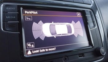 Parking sensor display showing vehicle proximity alerts.