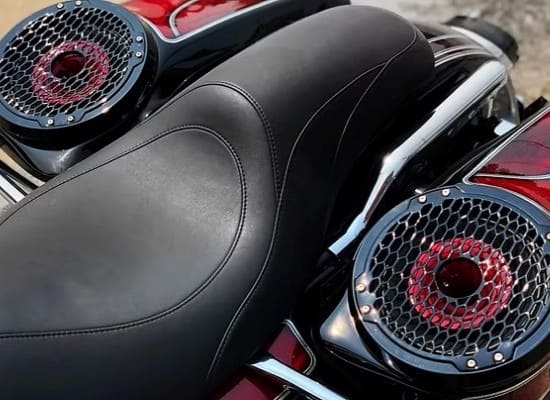 Custom motorcycle seat with integrated speakers and stylish finish.