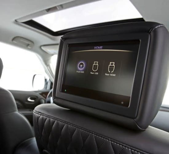 Modern car headrest with built-in entertainment screen and connectivity options.