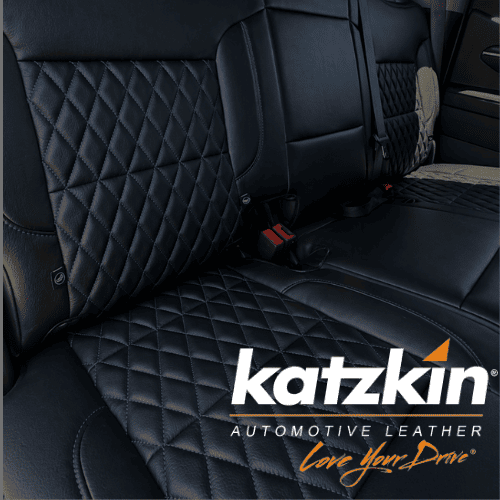 Custom black quilted leather seat covers for car interiors.