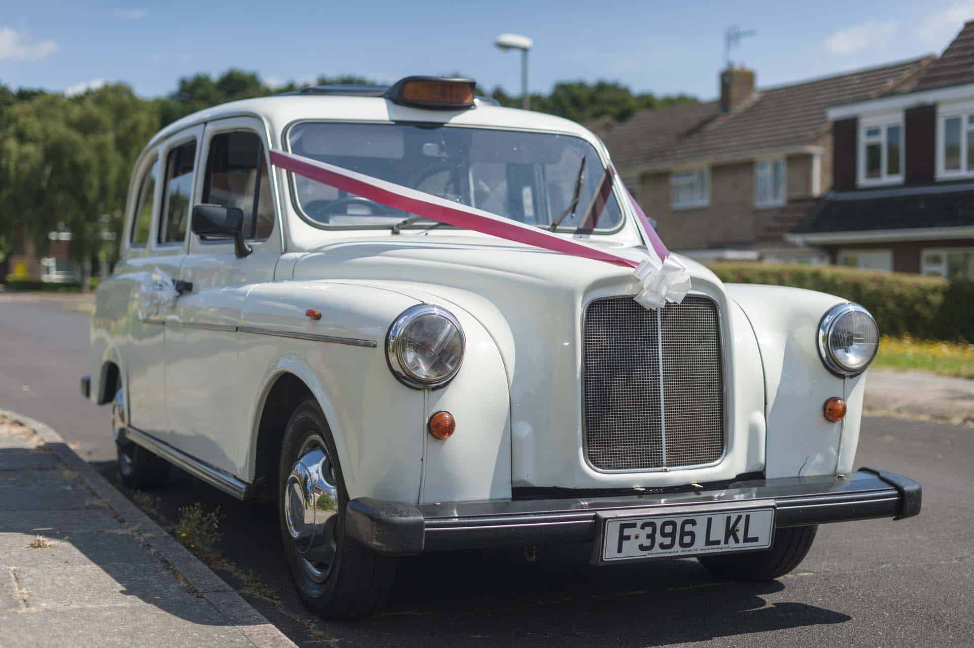50mm nifty fifty lens wedding photographer 120042 Canterbury Kent Wedding wedding car white taxi