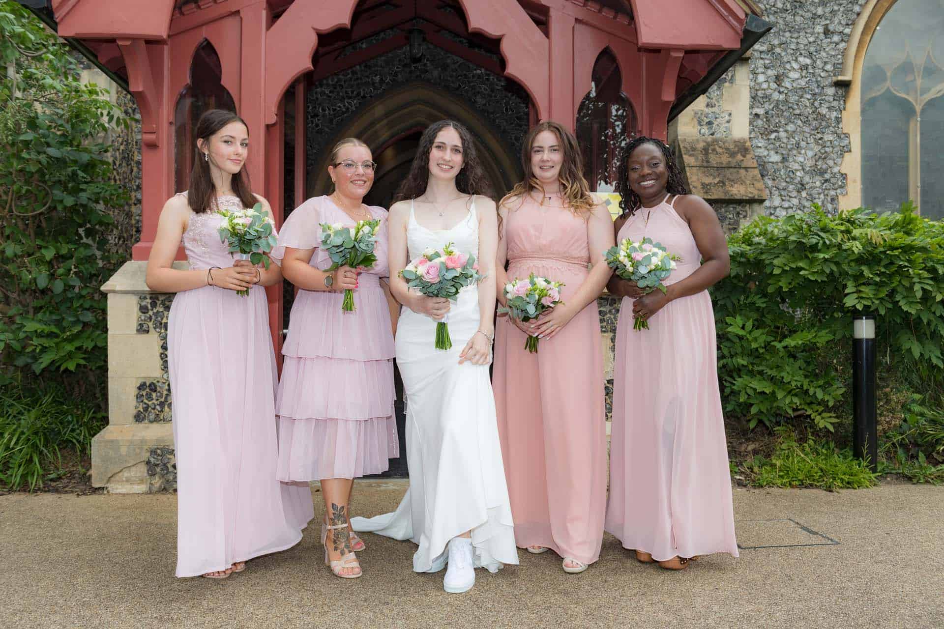 bride and mismatched bridesmaids Holy Trinity Church Wallington Surrey wedding Bromley kent wedding photographer