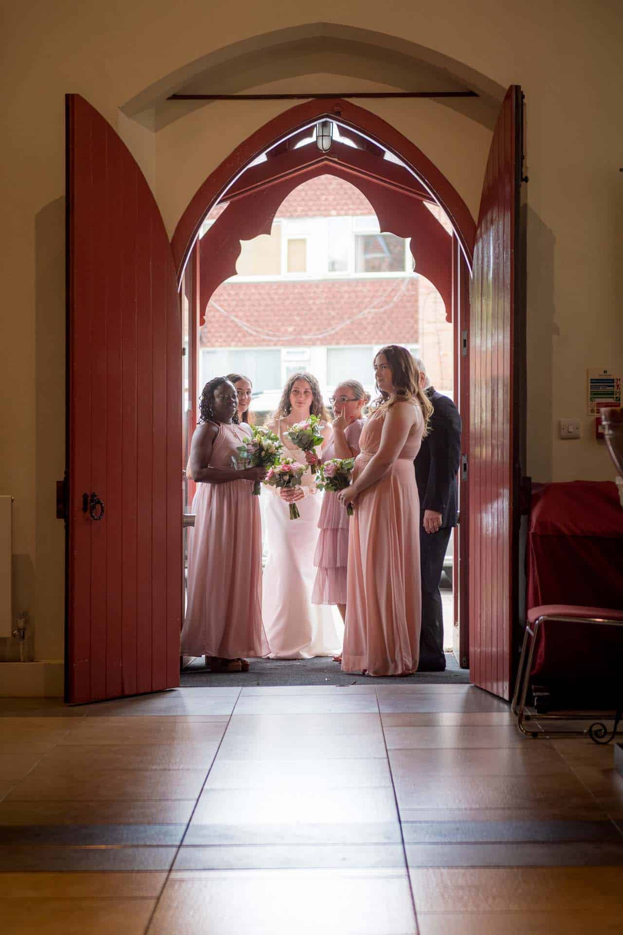 mismatched bridesmaids bride and maids arriving Holy Trinity Church Wallington Surrey wedding Bromley kent wedding photographer