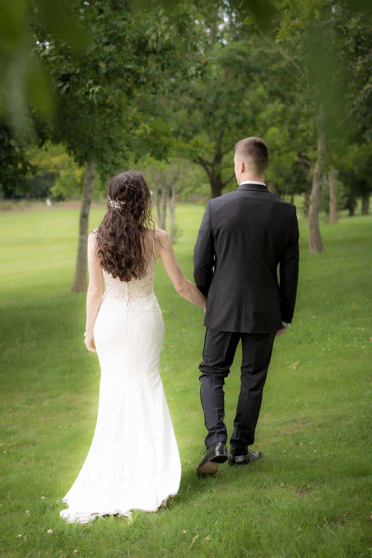 Bride and Groom walking away portrait Wallington Surrey wedding chipstead golf club reception Bromley kent wedding photographer