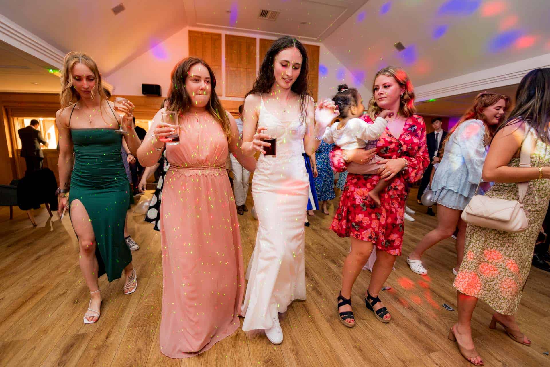 Bride and fri9ends dancing Wallington Surrey wedding chipstead golf club reception Bromley kent wedding photographer 202756