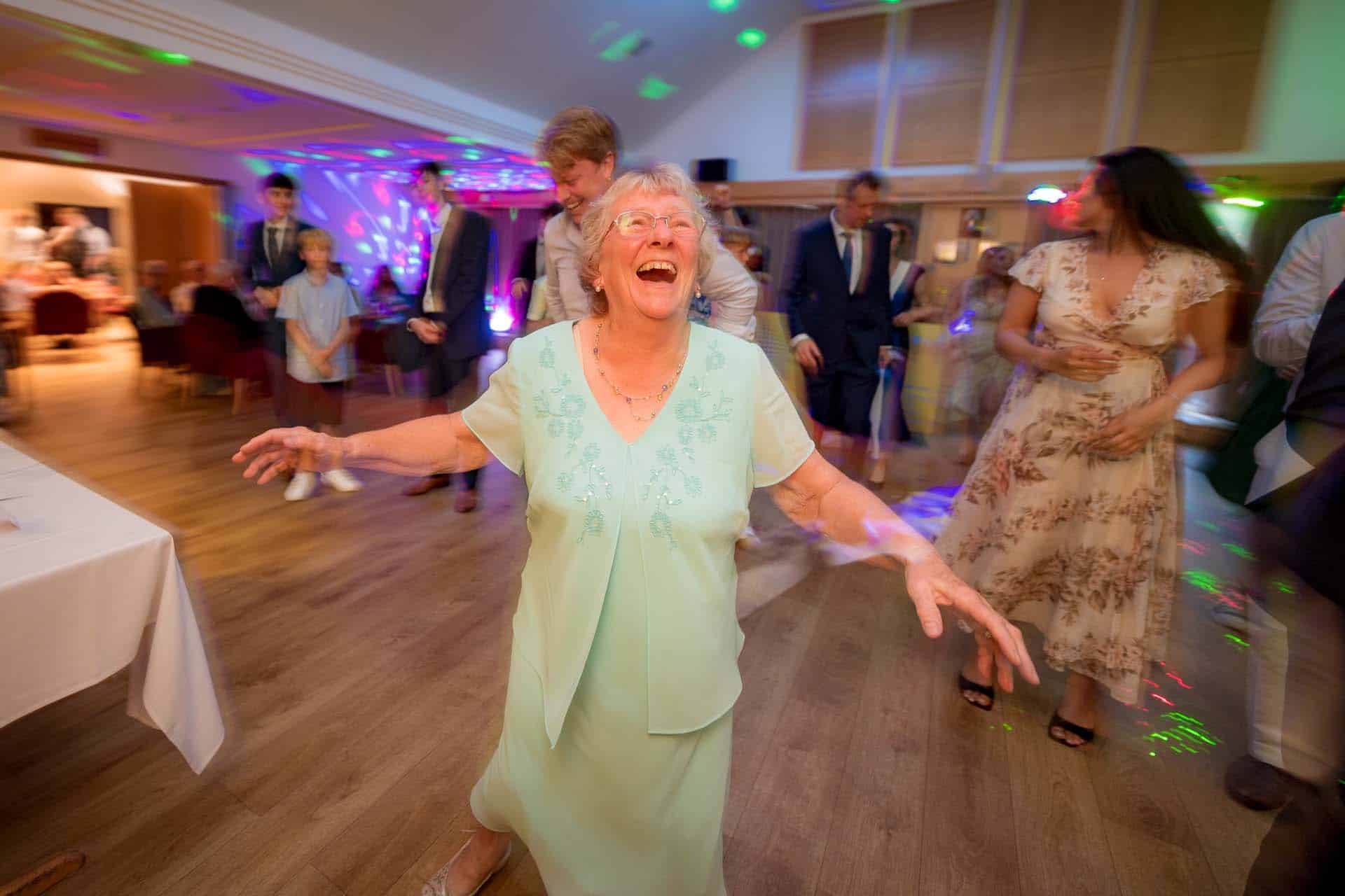 Grandma dancing Ollie & Sam Wallington Surrey wedding chipstead golf club reception Bromley kent wedding photographer 203102