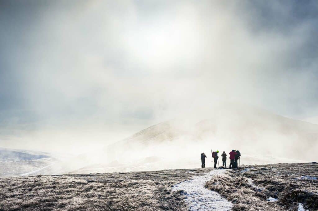 Bynack More from the North. The group meets up before heading up the broad summit ridge.
