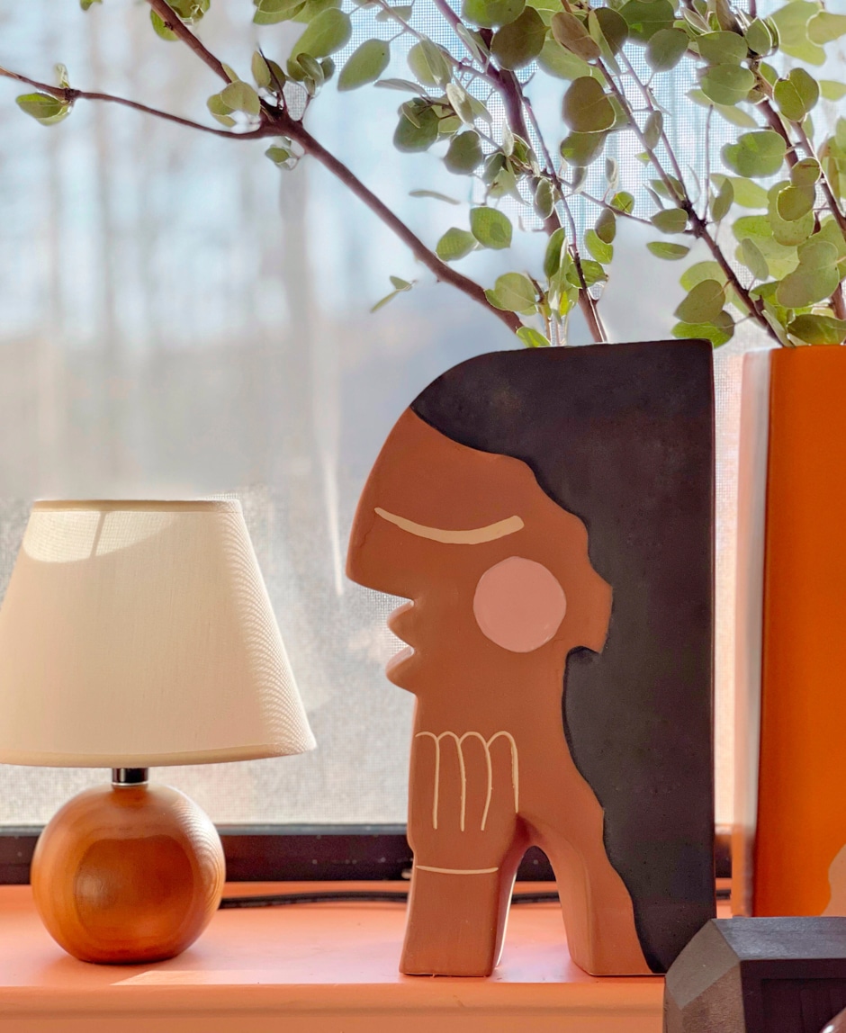 artwork on shelf in redesigned gym home gym ideas