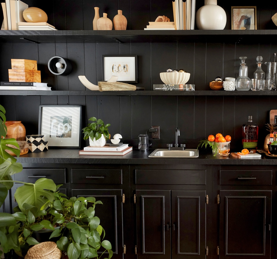 black bookshelves and home bar installation