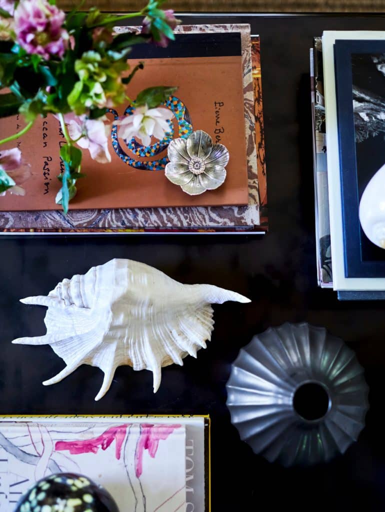 bronze and veneer coffee table with decorations on top