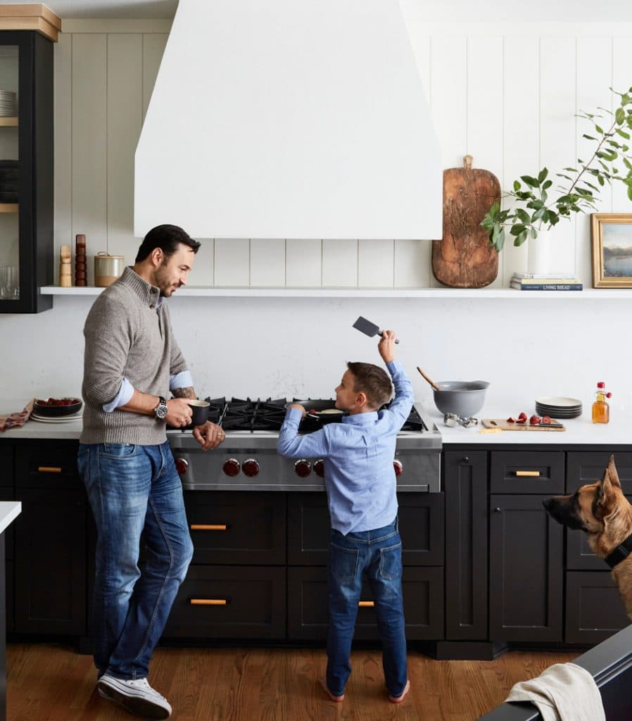 dad and son cooking in kitchen