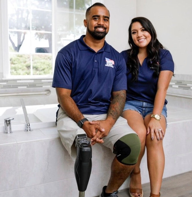 Darryl and Desiree sitting at accessible bathtub