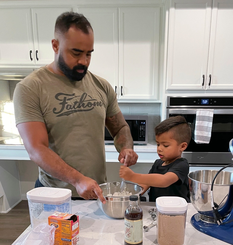 Darryl and son making cookies in the kitchen