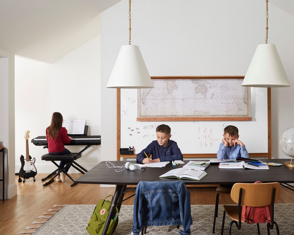 kids doing homework and practicing music in school room