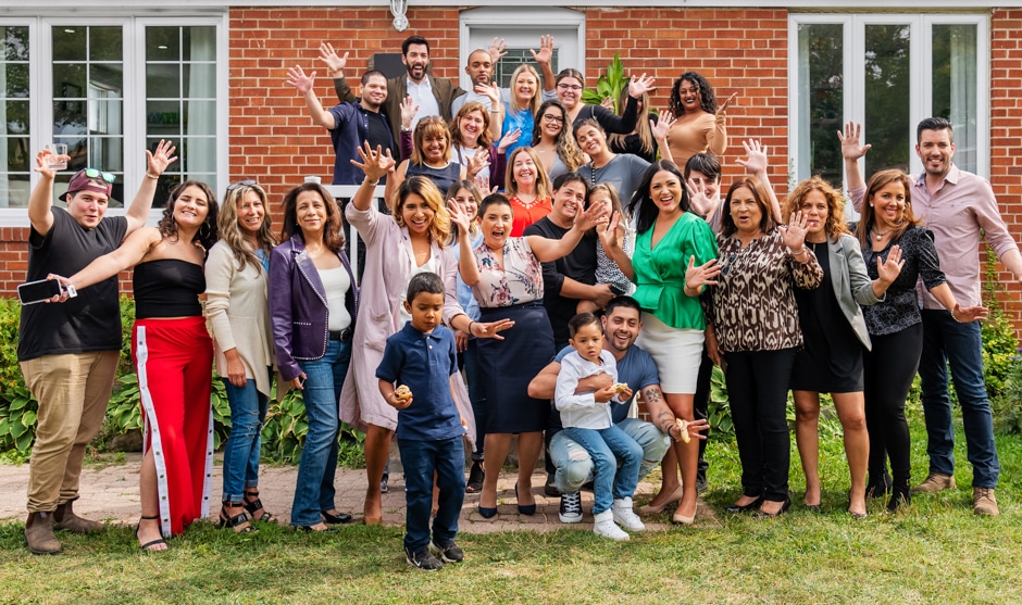 big group celebrating home renovation