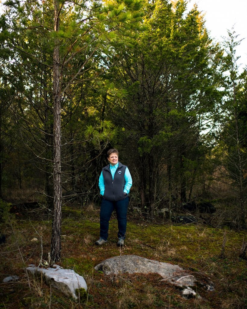 janet dalton standing in forest