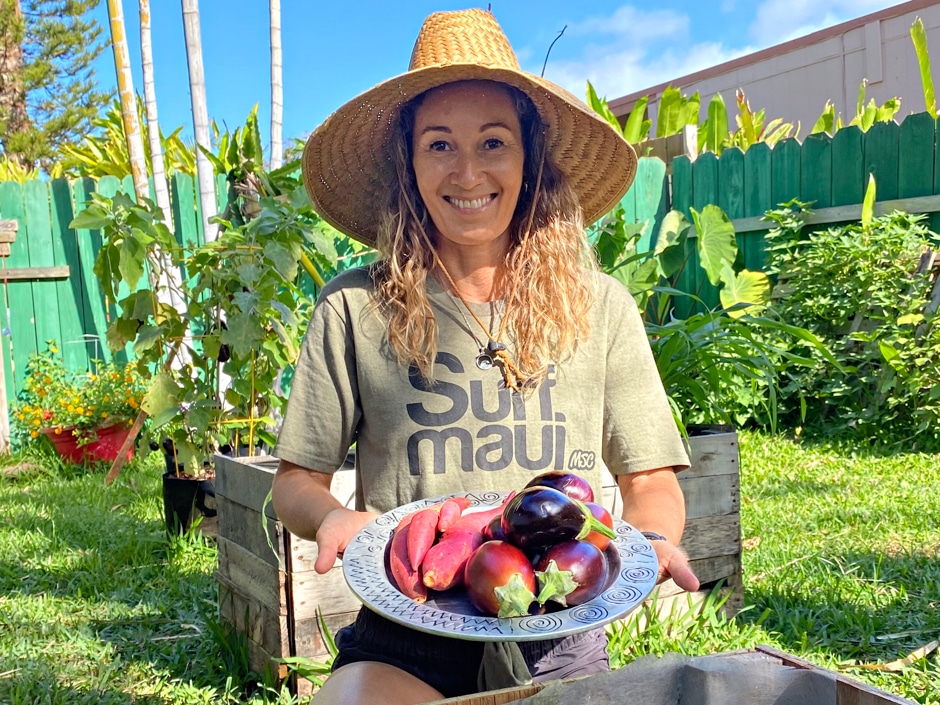 Kat holding plate of garden produce