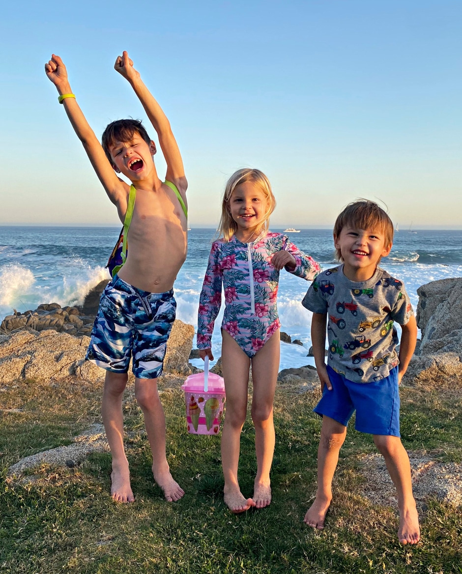 kids playing by the ocean in Mexico