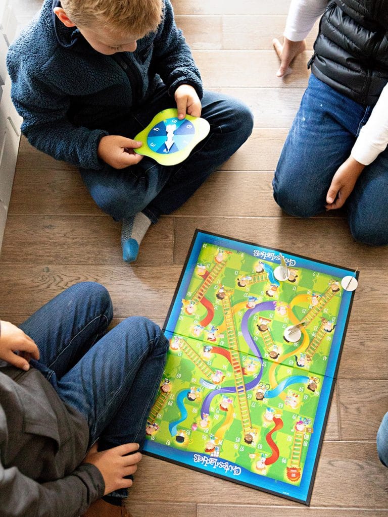 kids playing chutes and ladders, family game night ideas