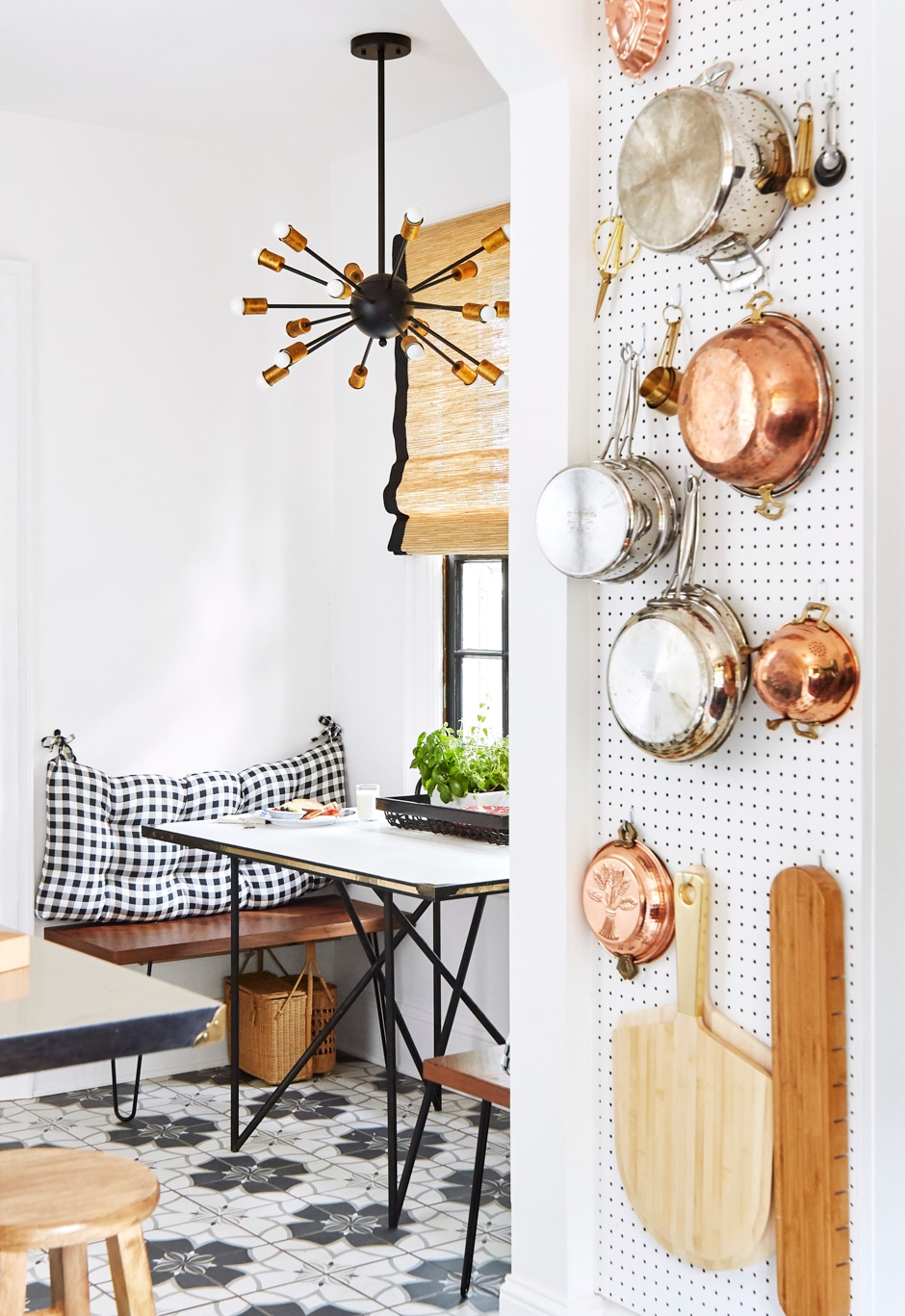 narrow wall space with pegboard and kitchen appliances