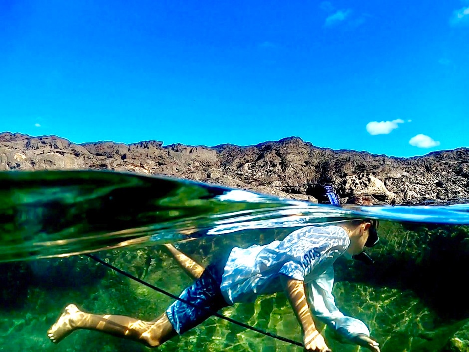 boy spearfishing in hawaii