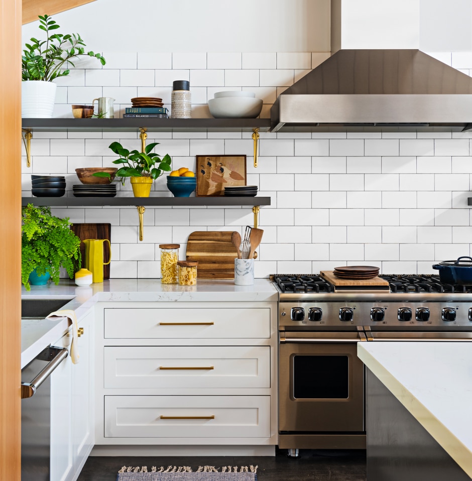 white kitchen with wooden ceiling and open shelving