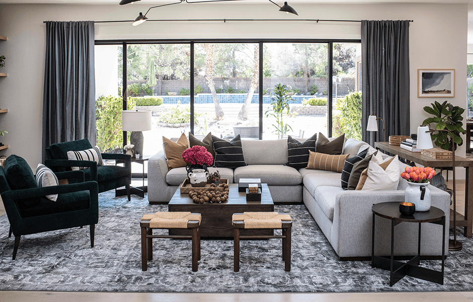 Living room with sectional sofa and large windows