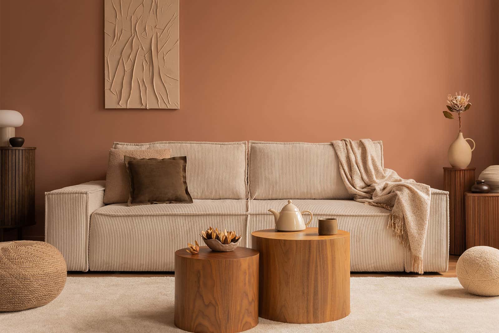 Beige sofa with wooden tables in a warm-toned living room