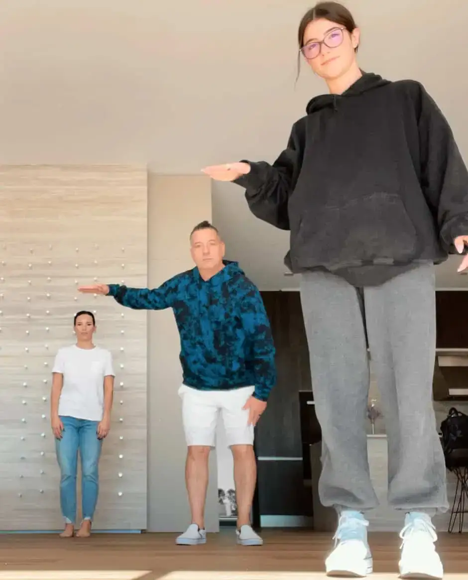 family creating tiktok video in kitchen