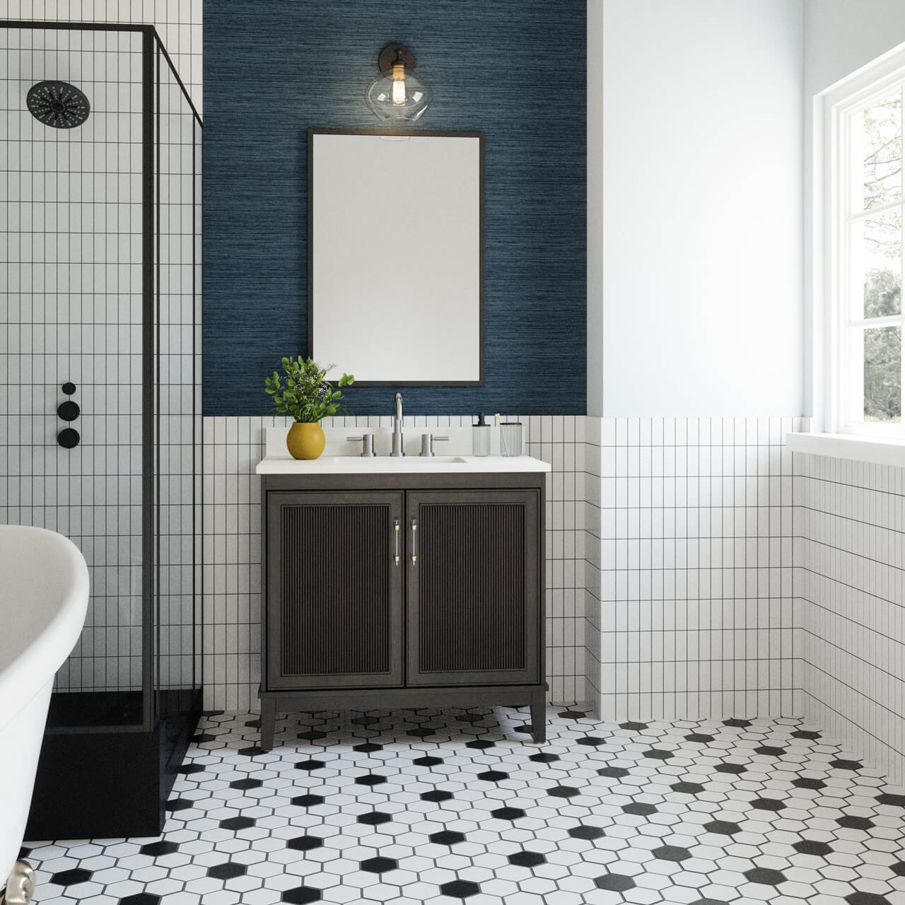Bathroom with black vanity, hex tile floor, and glass shower enclosure