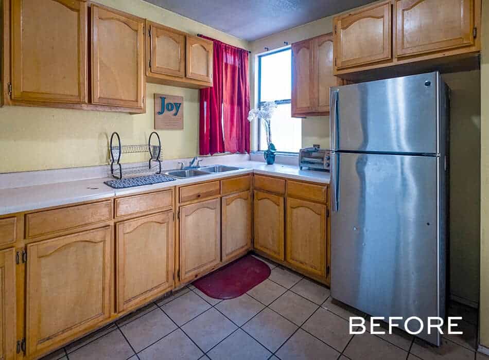 Before image of a small, outdated kitchen with yellow walls, wood cabinets, and white countertops