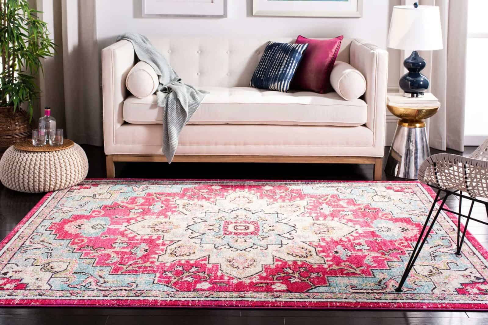 Colorful medallion rug in a bright living room with a cream sofa and accent pillows