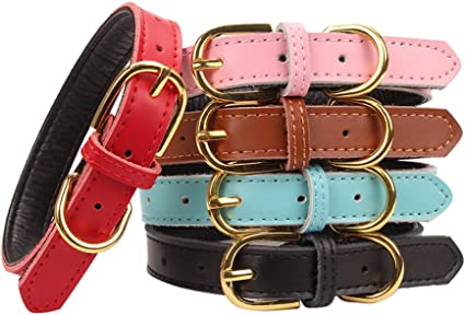 Stack of colorful leather belts with gold buckles